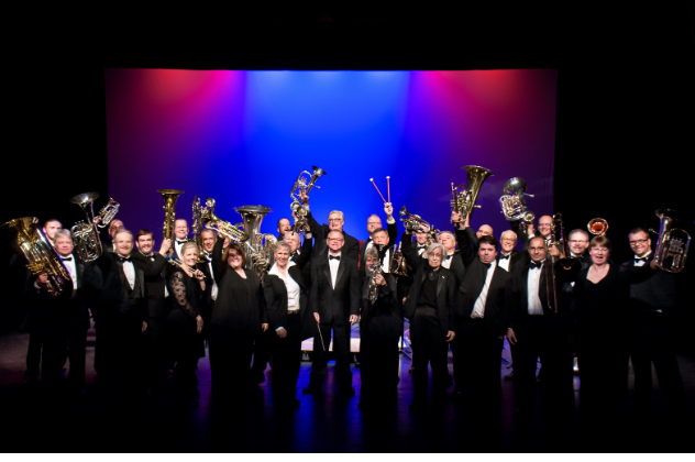 Sheldon Brass Band Holiday Concert - Nov 28 brass band on stage holding up brass instruments