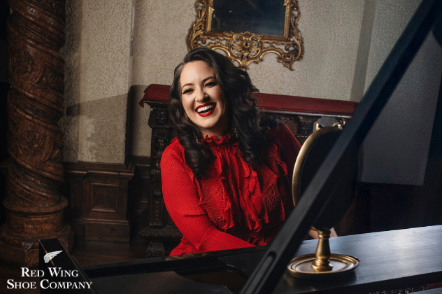 Nicole Zuraitis - Mar 13 woman smiling and playing the piano