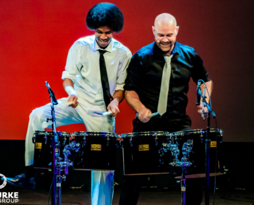 Collision of Rhythm - Apr 2 two men playing drums and dancing